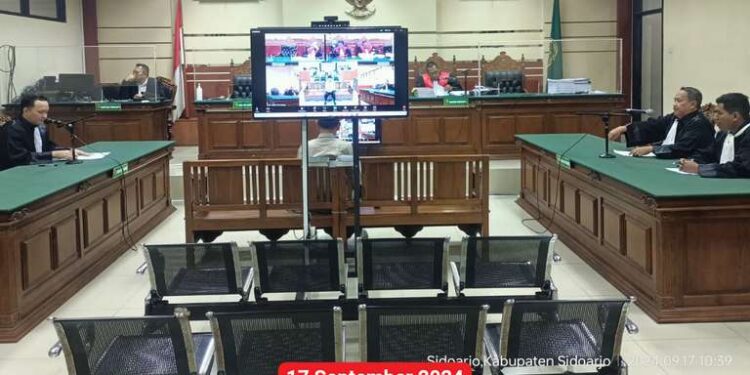 SIDANG PERTAMA PADA PERKARA DUGAAN TINDAK PIDANA KORUPSI DALAM PENYERTAAN MODAL BUMD / PT. SUMBER DAYA KEPADA PT. AMAN PADA TA. 2019 DENGAN AGENDA PEMBACAAN SURAT DAKWAAN