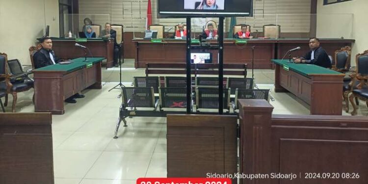 SIDANG KEDUA BELAS PADA PERKARA DUGAAN TINDAK PIDANA KORUPSI DALAM PENGELOLAAN APBDES DLAMBAH DAJAH, KEC. TANAH MERAH, KAB. BANGKALAN YANG BERSUMBER DARI ADD TA 2019 DAN PEMBAYARAN SILTAP DAN TUNJANGAN PERANGKAT DESA DLAMBAH DAJAH TA 2018 DAN 2020